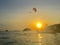 Parachutist in the sunny background in sunset