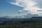 Parachutists gliding in blue sky over scenic landscape of Crimea, Ukraine,