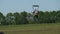 Parachutists in Tandem Flying in the Sky and Landing on Field, Slow Motion