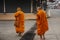Parade of monks walking for received travelers and thai people respect praying put food and things offerings to monk at local