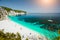 Paradise beach with clear azure emerald sea water surrounded by high white rocky cliffs. Fteri beach in Kefalonia Island