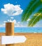 Paradise beach with empty wooden sign - Vacation concept