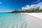 Paradise Beach with white sand and crystal clear turquoise water. Tropical destination, travel advertisement background