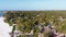 Paradise Coast Resort with Palm Trees and Hotels by Ocean, Zanzibar, Aerial view