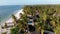 Paradise Coast Resort with Palm Trees and Hotels by Ocean, Zanzibar, Aerial view