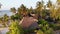 Paradise Coast Resort with Palm Trees and Hotels by Ocean, Zanzibar, Aerial view