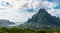 Paradise Island, French Polynesia, blue water and green mountains.