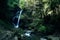 Paradise jungle forest with beautiful waterfall in green lush of Erawan park in Kanchanaburi, Thailand. Emerald pond and