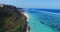 Paradise view above the sea. Idyllic aerial view of empty tropical beach, blue sea, white foam waves in Bali. Above the