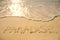 Paradise Written in Sand on Beach