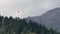 Paraglide flying on Dolomiti mountains and woods