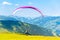 Paraglide launching. Starting procedure of paraglider on high mountain meadow. Recreational and competitive adventure