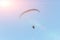 paraglide with a motor high in the sky