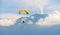 Paraglider against the French Alps on a sunny day, soaring high above the majestic mountains