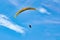 Paraglider on the background of bright blue sky