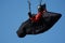 Paraglider on the background of bright blue sky