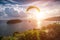 Paraglider chasing the sunset on Windmill Viewpoint. Phuket, Thailand