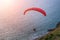 Paraglider chasing the sunset on Windmill Viewpoint. Phuket, Thailand