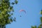 Paraglider flies in the air -Aerial view of paraglider.