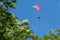 Paraglider flies in the air -Aerial view of paraglider.