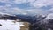 Paraglider flies over the snow-capped mountains. Mountains of the Caucasus