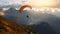 Paraglider floating over mountain ranges