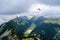 A paraglider flying above Hoher Kasten mountain