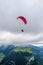 A paraglider flying above Hoher Kasten mountain