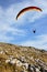 Paraglider flying low