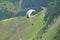 Paraglider flying in the mountains