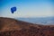 Paraglider flying over mountains in autumn. Beautiful mountain landscape. Paragliding in the sky. Extreme sport activity