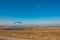 Paraglider flying in the sky on a Sunny day active in Koktebel