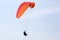 Paraglider flying on a wing in the sky