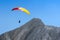 Paraglider free soaring in cloudless sky over dolomites Alpine m