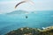 A paraglider glides over Shek O from the Dragon`s Back Trail in Shek O Country Park, Hong Kong