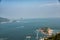 A paraglider glides over Shek O from the Dragon`s Back Trail in Shek O Country Park, Hong Kong