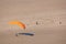 Paraglider landing on the beach