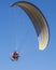 Paraglider motor in the blue sky