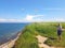 Paraglider near cliff along baltic sea coastline