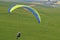 Paraglider pilot taking off