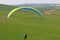 Paraglider pilot taking off