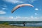 Paraglider prepares to fly over beautiful Bakota reservoir.