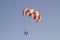 Paraglider with a saddle for people. Parasales - water parachutes. Bright colours