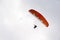 Paraglider seen from below alone in the sky