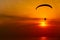 Paraglider silhouette against the background of the sunset sky