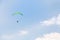 Paraglider soaring in the sky among clouds, Limassol