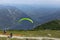 A paraglider at the start of the Krippenstein mountain in the Dachstein area,Austria.Paraglide silhouette over Hallstatter See.