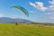 Paraglider starts flight from the hill in Liptovsky Trnovec, Slovakia.