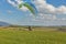 Paraglider starts flight from the hill in Liptovsky Trnovec, Slovakia.