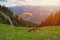 Paraglider taking off in front of spectacular mountain scenery